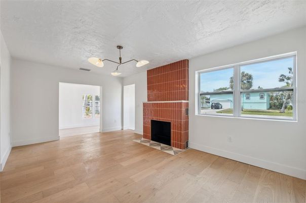 Empty room, Fireplace, Interior, Pendant Lights, Wood Texture Flooring