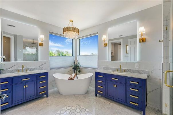 Bathroom, Chandelier, Dual Sink Vanities, Free Standing Baths, Interior, Marble, Marble Walls