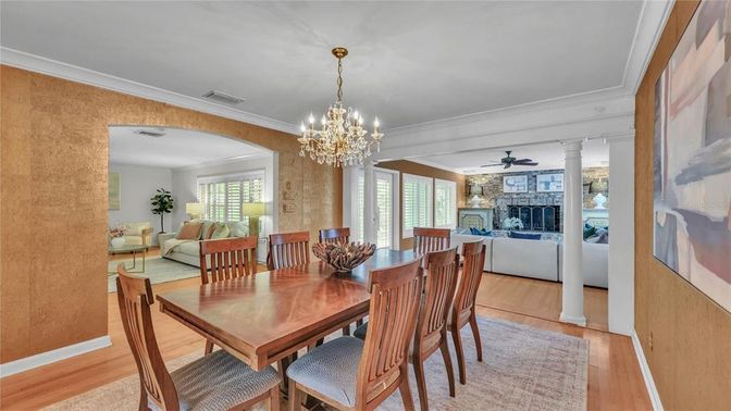 Chandelier, Dining room, Fireplace, Interior, Living room, Stone Walls, Wood Texture Flooring