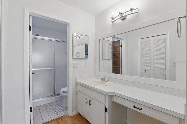 Bathroom, Dual Sink Vanities, Glass Shower, Interior, Wood Texture Flooring