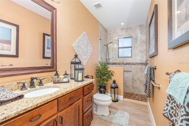 Bathroom, Dual Sink Vanities, Glass Shower, Interior, Recessed Lighting, Wood Texture Flooring