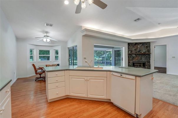 Fireplace, Interior, Kitchen, Recessed Lighting, Wood Texture Flooring