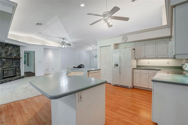 Fireplace, Interior, Kitchen, Recessed Lighting, Wood Texture Flooring