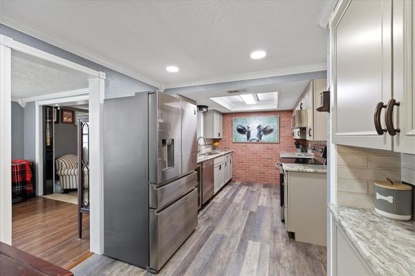 Interior, Kitchen, Recessed Lighting, Stainless Steel Appliances, Stone Walls, Wood Texture Flooring