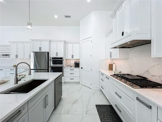 Interior, Kitchen, Marble, Marble Walls, Pendant Lights, Recessed Lighting, Stainless Steel Appliances