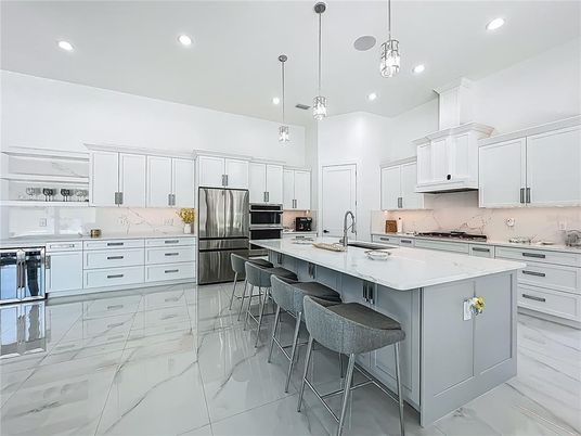 Interior, Kitchen, Marble, Marble Walls, Pendant Lights, Recessed Lighting, Stainless Steel Appliances