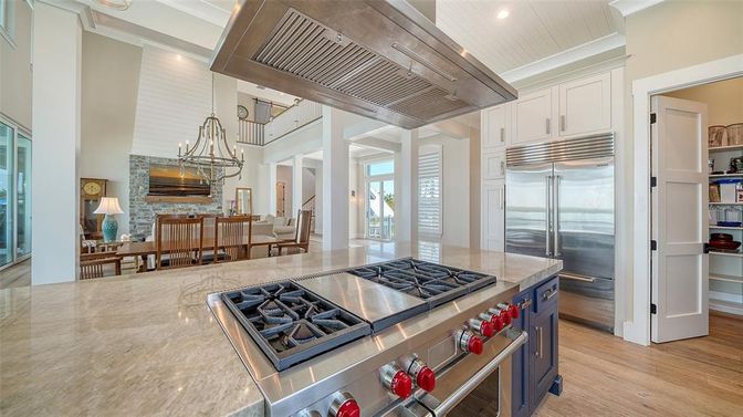 Chandelier, Dining room, Interior, Kitchen, Pendant Lights, Recessed Lighting, Stainless Steel Appliances, Wood Texture Flooring