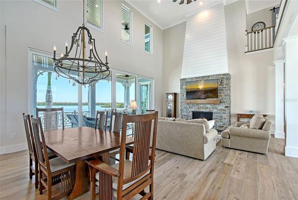 Chandelier, Dining room, Fireplace, Interior, Living room, Water, Wood Texture Flooring