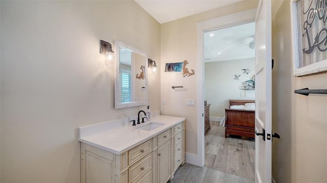 Bathroom, Dual Sink Vanities, Interior, Recessed Lighting, Wood Texture Flooring
