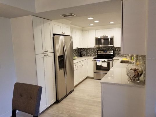 Interior, Kitchen, Recessed Lighting, Stainless Steel Appliances, Wood Texture Flooring