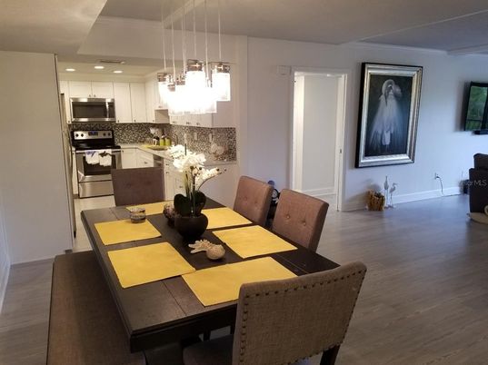 Dining room, Interior, Kitchen, Pendant Lights, Recessed Lighting, Stainless Steel Appliances, Wood Texture Flooring