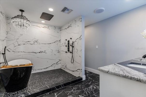 Bathroom, Chandelier, Dual Sink Vanities, Interior, Marble, Marble Walls, Recessed Lighting