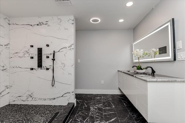 Bathroom, Dual Sink Vanities, Interior, Marble, Marble Walls, Recessed Lighting