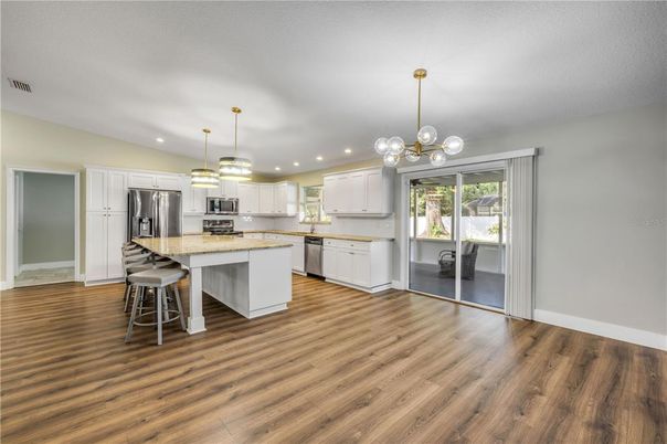 Interior, Kitchen, Pendant Lights, Recessed Lighting, Stainless Steel Appliances, Wood Texture Flooring