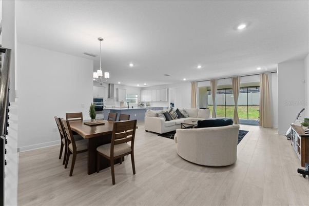 Chandelier, Dining room, Interior, Kitchen, Living room, Pendant Lights, Recessed Lighting, Wood Texture Flooring