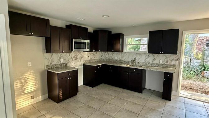 Interior, Kitchen, Marble Walls, Recessed Lighting, Stainless Steel Appliances