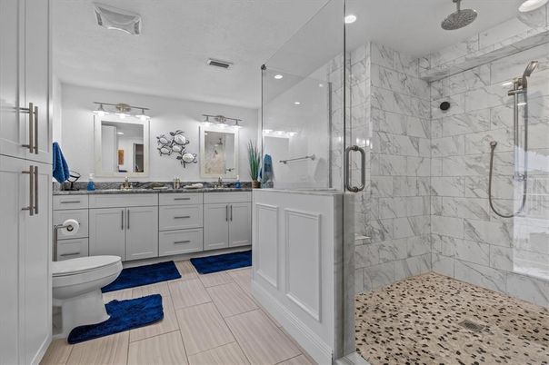 Bathroom, Dual Sink Vanities, Glass Shower, Interior, Marble Walls, Recessed Lighting