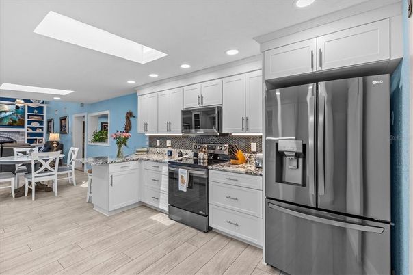 Dining room, Interior, Kitchen, Recessed Lighting, Stainless Steel Appliances, Wood Texture Flooring