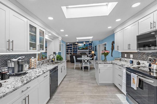Dining room, Interior, Kitchen, Recessed Lighting, Stainless Steel Appliances, Wood Texture Flooring