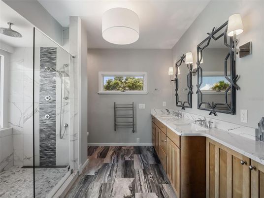 Bathroom, Dual Sink Vanities, Glass Shower, Interior, Marble Walls, Wood Texture Flooring