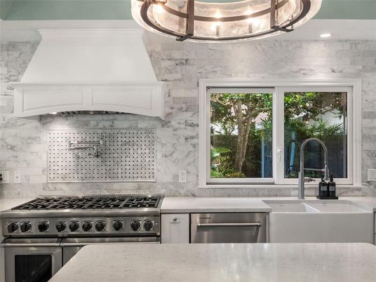 Interior, Kitchen, Marble Walls, Recessed Lighting, Stainless Steel Appliances