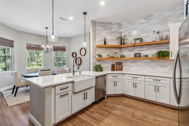 Dining room, Interior, Kitchen, Pendant Lights, Recessed Lighting, Stainless Steel Appliances, Wood Texture Flooring