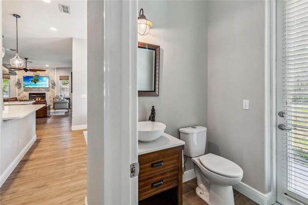 Bathroom, Fireplace, Interior, Living room, Pendant Lights, Recessed Lighting, Wood Texture Flooring