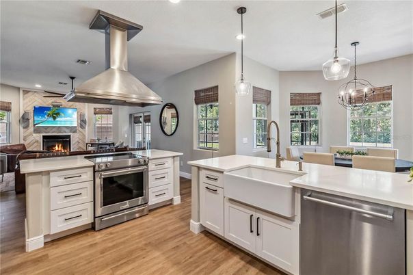 Fireplace, Interior, Kitchen, Pendant Lights, Recessed Lighting, Stainless Steel Appliances, Wood Texture Flooring