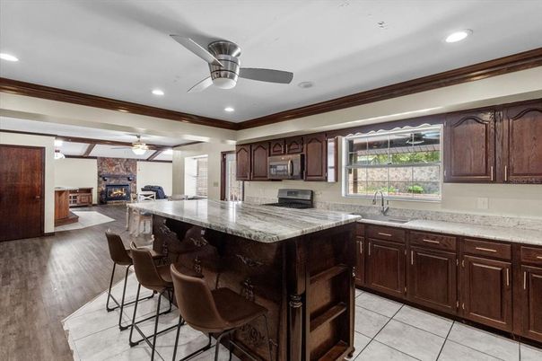 Fireplace, Interior, Kitchen, Recessed Lighting, Wood Texture Flooring
