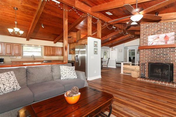 Chandelier, Fireplace, Interior, Kitchen, Living room, Pendant Lights, Stainless Steel Appliances, Stone Walls, Wooden Beams, Wooden Ceilings, Wood Texture Flooring