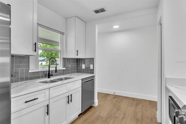 Interior, Kitchen, Recessed Lighting, Stainless Steel Appliances, Wood Texture Flooring
