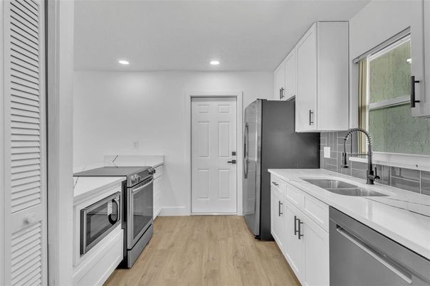 Interior, Kitchen, Recessed Lighting, Stainless Steel Appliances, Wood Texture Flooring