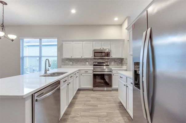 Interior, Kitchen, Pendant Lights, Recessed Lighting, Stainless Steel Appliances, Wood Texture Flooring
