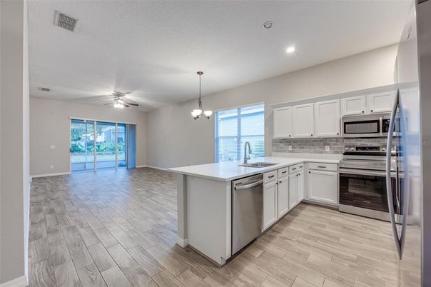 Chandelier, Interior, Kitchen, Recessed Lighting, Stainless Steel Appliances, Wood Texture Flooring