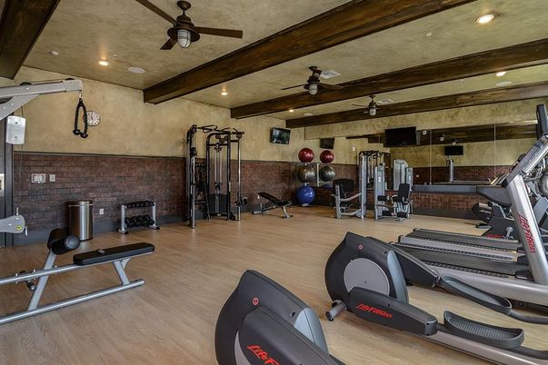 Fitness Equipment, Gym, Interior, Recessed Lighting, Stone Walls, Wood Texture Flooring