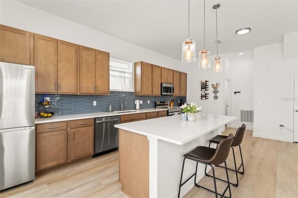 Interior, Kitchen, Pendant Lights, Recessed Lighting, Stainless Steel Appliances, Wood Texture Flooring