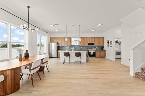 Dining room, Interior, Kitchen, Pendant Lights, Recessed Lighting, Stainless Steel Appliances, Wood Texture Flooring