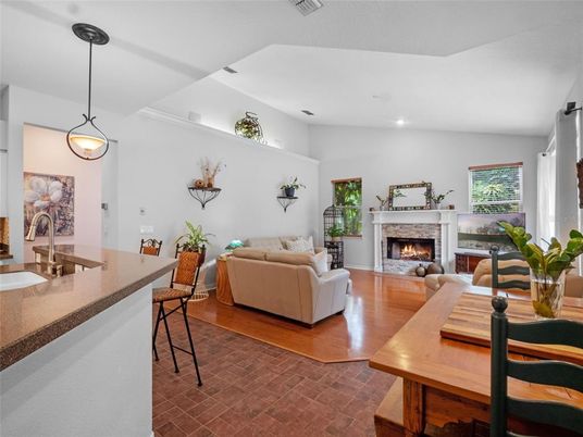 Dining room, Fireplace, Interior, Living room, Pendant Lights, Recessed Lighting, Wood Texture Flooring