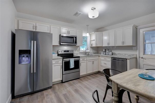 Dining room, Interior, Kitchen, Pendant Lights, Stainless Steel Appliances, Wood Texture Flooring