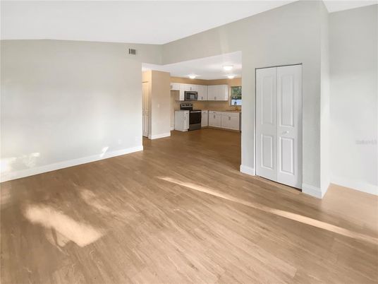 Empty room, Interior, Kitchen, Stainless Steel Appliances, Wood Texture Flooring