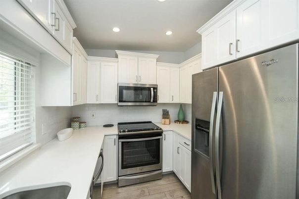 Interior, Kitchen, Recessed Lighting, Stainless Steel Appliances, Wood Texture Flooring