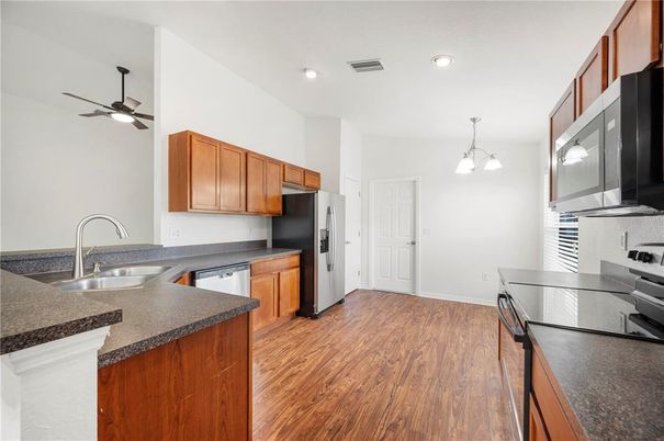 Interior, Kitchen, Pendant Lights, Recessed Lighting, Stainless Steel Appliances, Wood Texture Flooring
