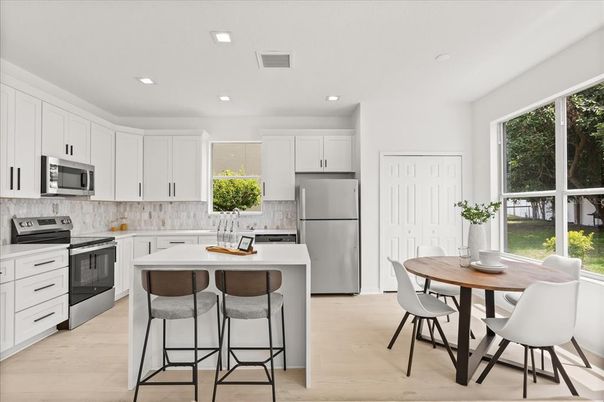 Dining room, Interior, Kitchen, Recessed Lighting, Stainless Steel Appliances, Wood Texture Flooring