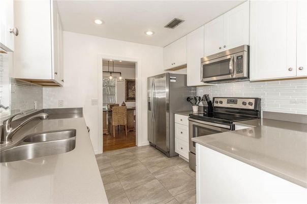 Dining room, Interior, Kitchen, Pendant Lights, Recessed Lighting, Stainless Steel Appliances, Wood Texture Flooring