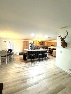 Dining room, Interior, Kitchen, Pendant Lights, Stainless Steel Appliances, Wood Texture Flooring