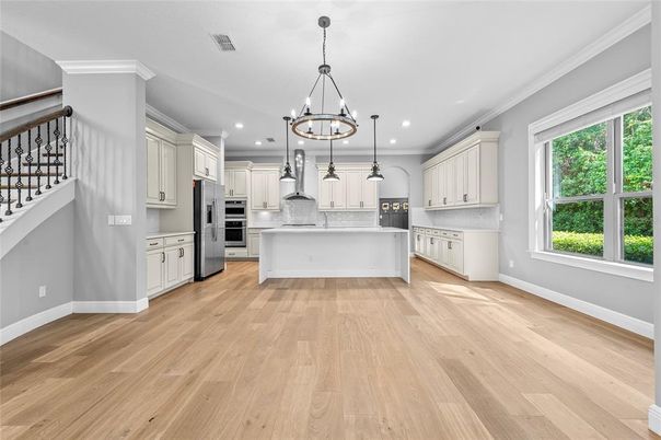 Chandelier, Interior, Kitchen, Pendant Lights, Recessed Lighting, Stainless Steel Appliances, Wood Texture Flooring