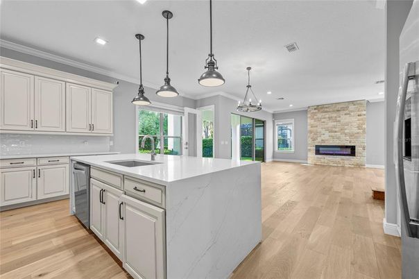 Fireplace, Interior, Kitchen, Pendant Lights, Recessed Lighting, Stone Walls, Wood Texture Flooring