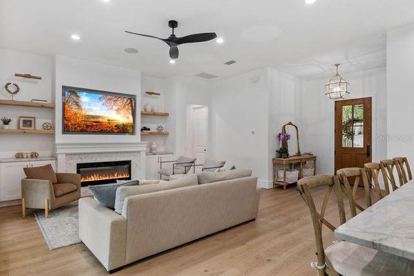 Dining room, Fireplace, Interior, Living room, Pendant Lights, Recessed Lighting, Wood Texture Flooring