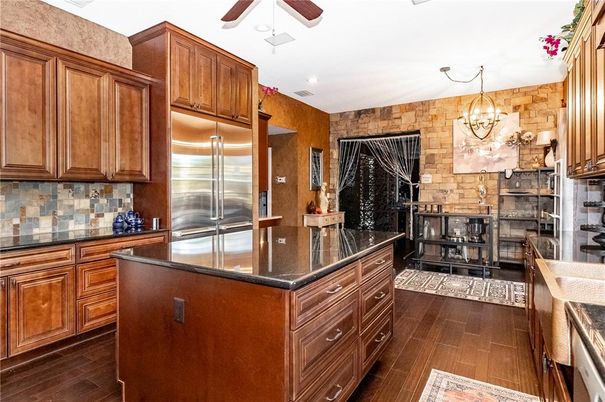 Chandelier, Interior, Kitchen, Pendant Lights, Stainless Steel Appliances, Stone Walls, Wood Texture Flooring