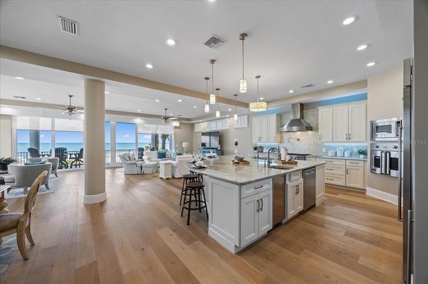 Dining room, Interior, Kitchen, Living room, Pendant Lights, Recessed Lighting, Stainless Steel Appliances, Water, Wood Texture Flooring